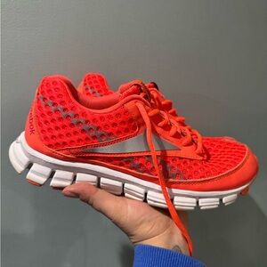 Reebok Women’s SmoothFlex Run Sneakers neon orange